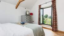 Views across the surrounding countryside can be enjoyed from the super-king bed.