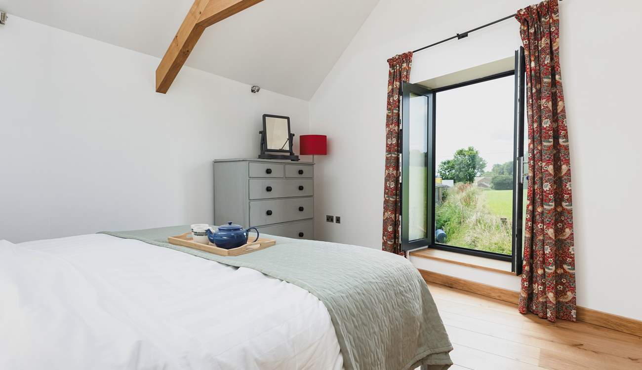 Views across the surrounding countryside can be enjoyed from the super-king bed.