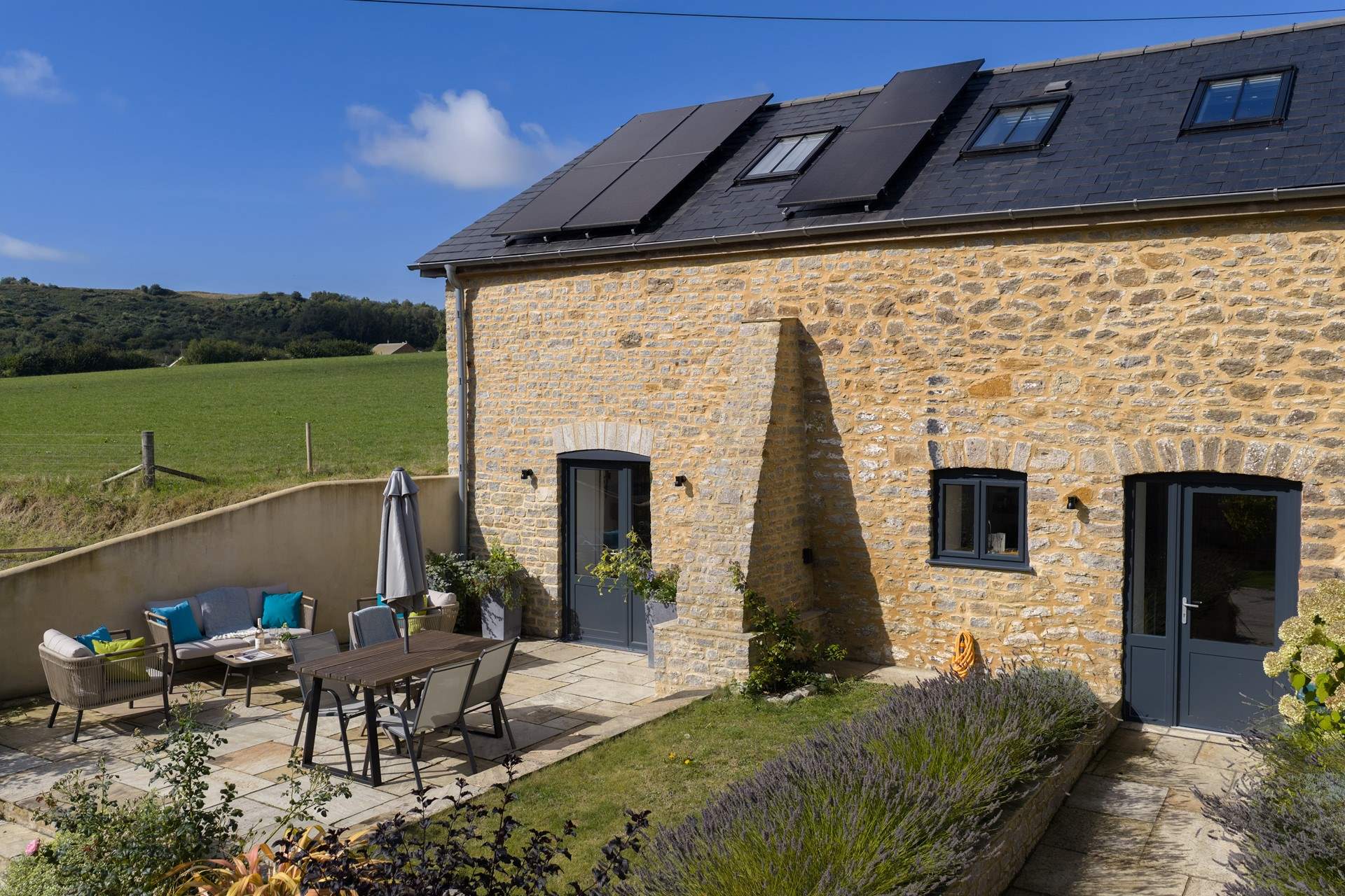 The Barn has a lovely patio space for al fresco dining and a lovely garden.