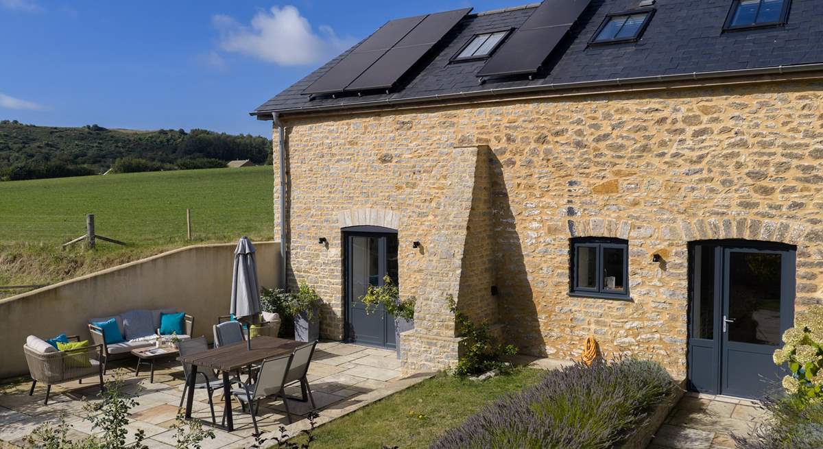 The Barn has a lovely patio space for alfresco dining and lovely garden.