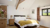 The spacious second is beautifully styled with a sumptuous king-size bed that can also be configured as two singles.