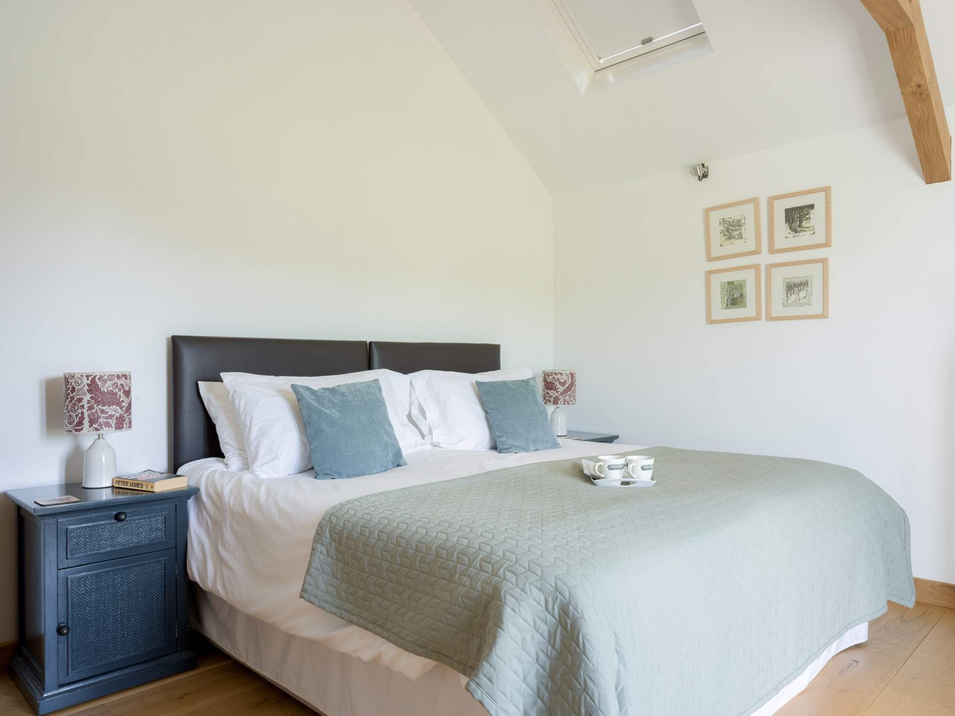 The main bedroom is serene and tastefully decorated.