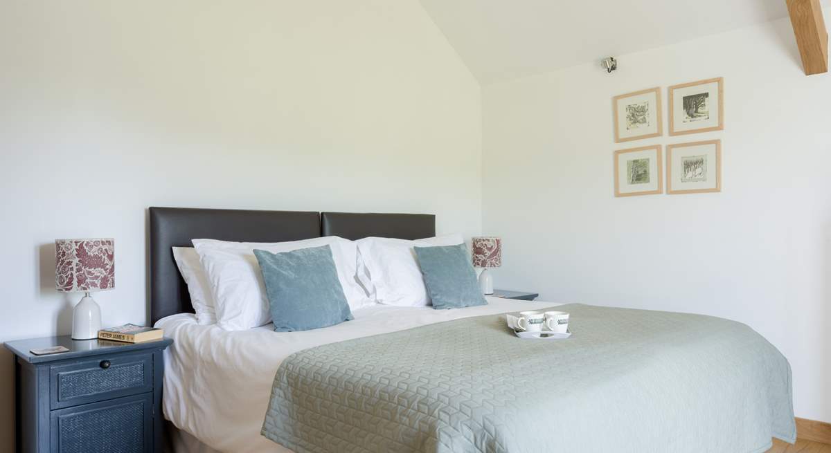 The main bedroom is serene and tastefully decorated