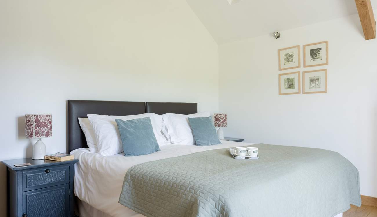 The main bedroom is serene and tastefully decorated.