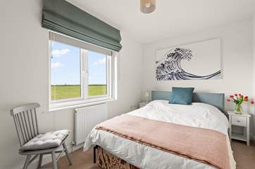 Pretty bedroom 4 is home to a comfy king-size double bed.