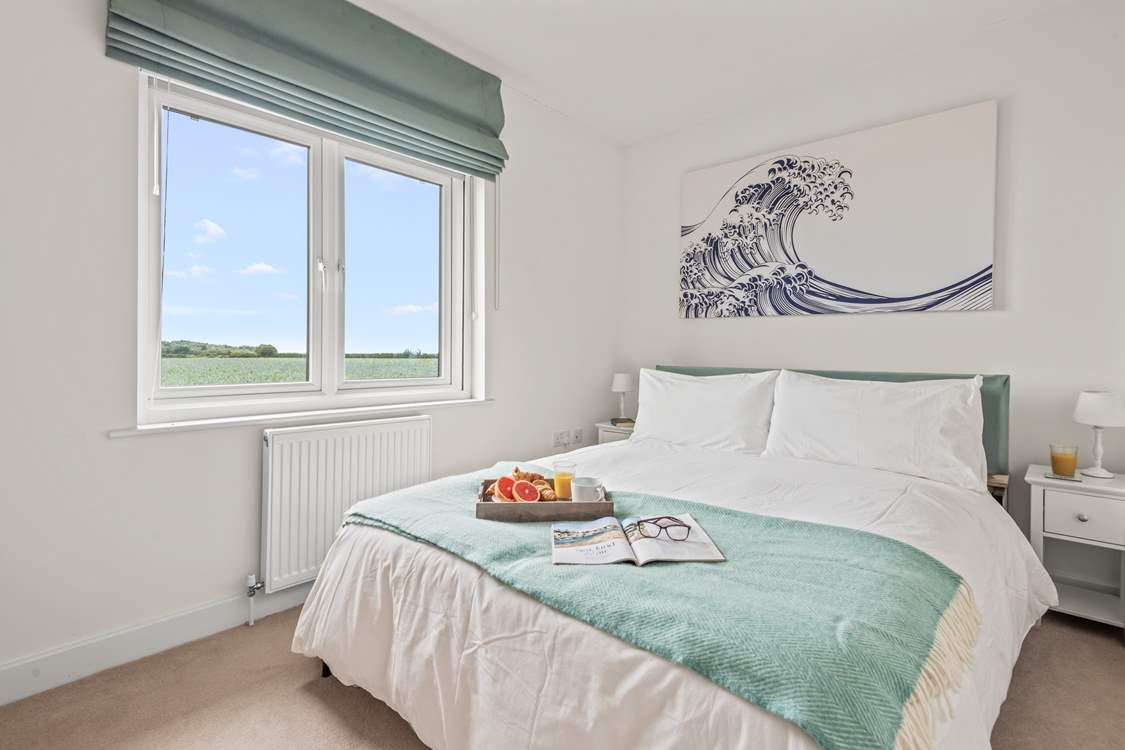 Pretty bedroom 4 is home to a comfy king-size double bed.