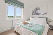 Pretty bedroom 4 is home to a comfy king-size double bed.