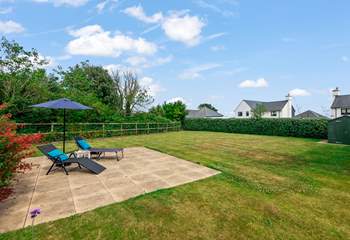 The large garden offers lots of different spaces to relax in.