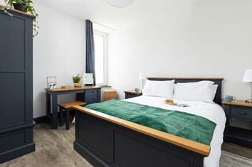 The bedroom has a king-size bed for a restful night.