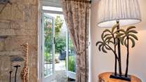 The patio doors lead to the terrace and beautiful gardens. 