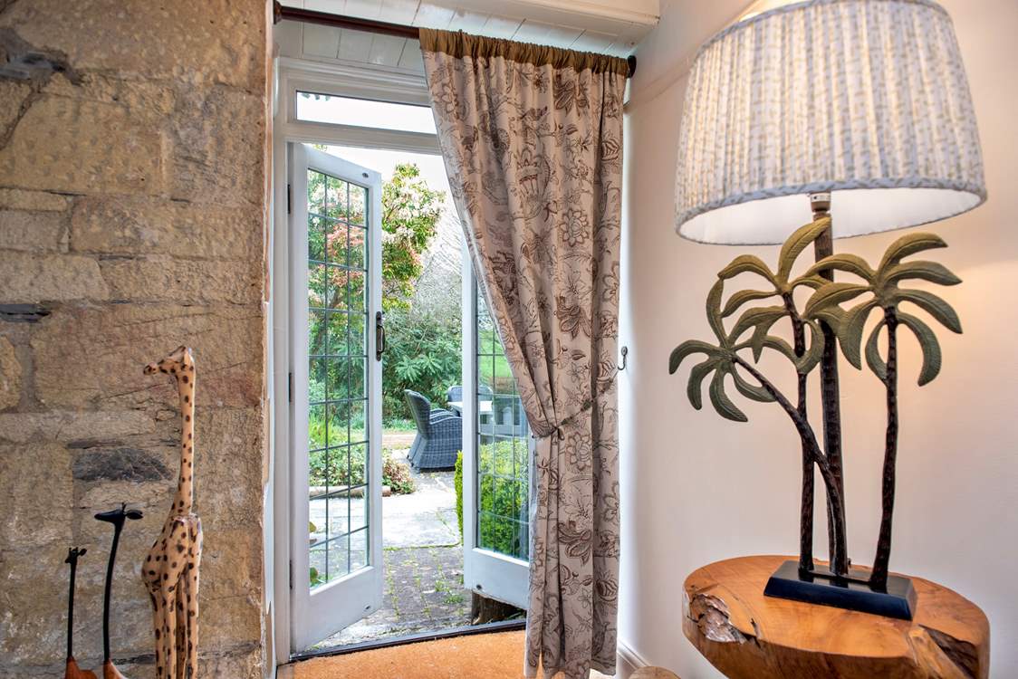 The patio doors lead to the terrace and beautiful gardens.