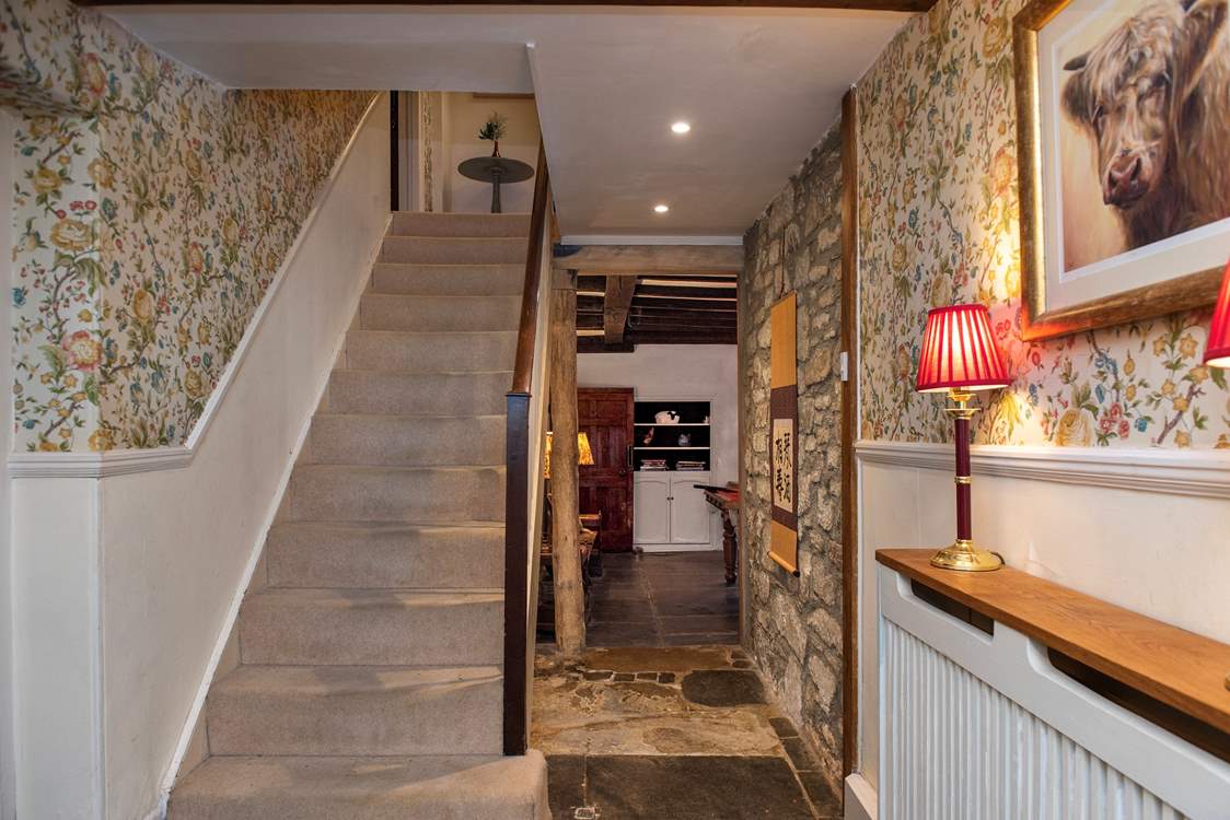 The staircase leads to the first floor bedrooms and family bathroom.