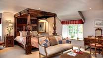 Bedroom 1 has a beautiful carved super-king four-poster bed. 