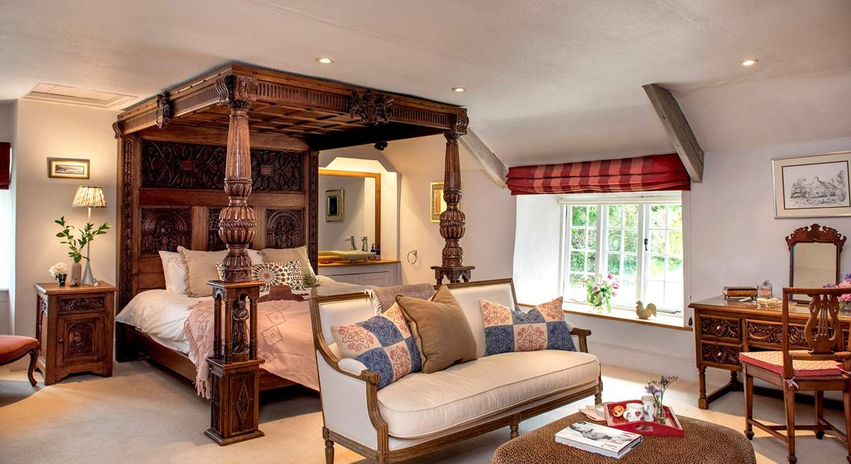 Bedroom 1 has a beautiful carved super-king four-poster bed. 