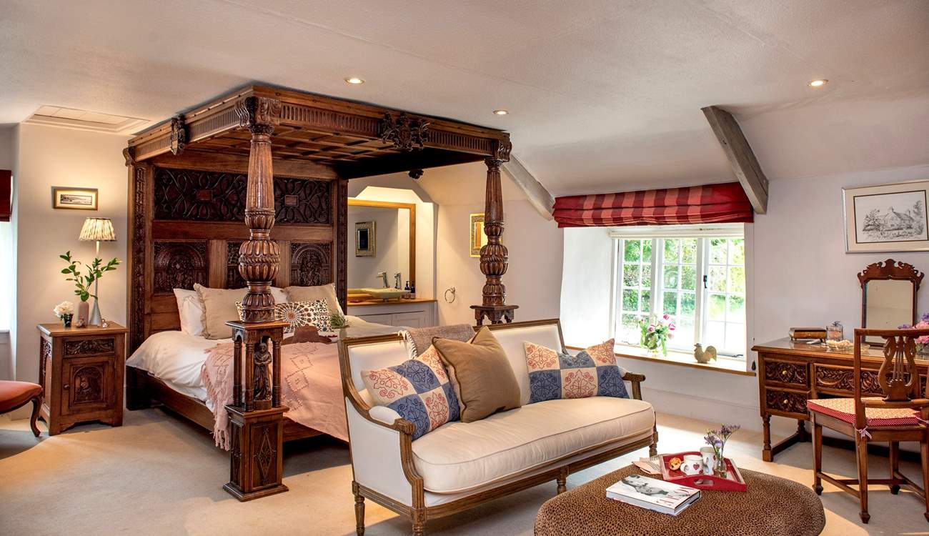 Bedroom 1 has a beautiful carved super-king four-poster bed. 