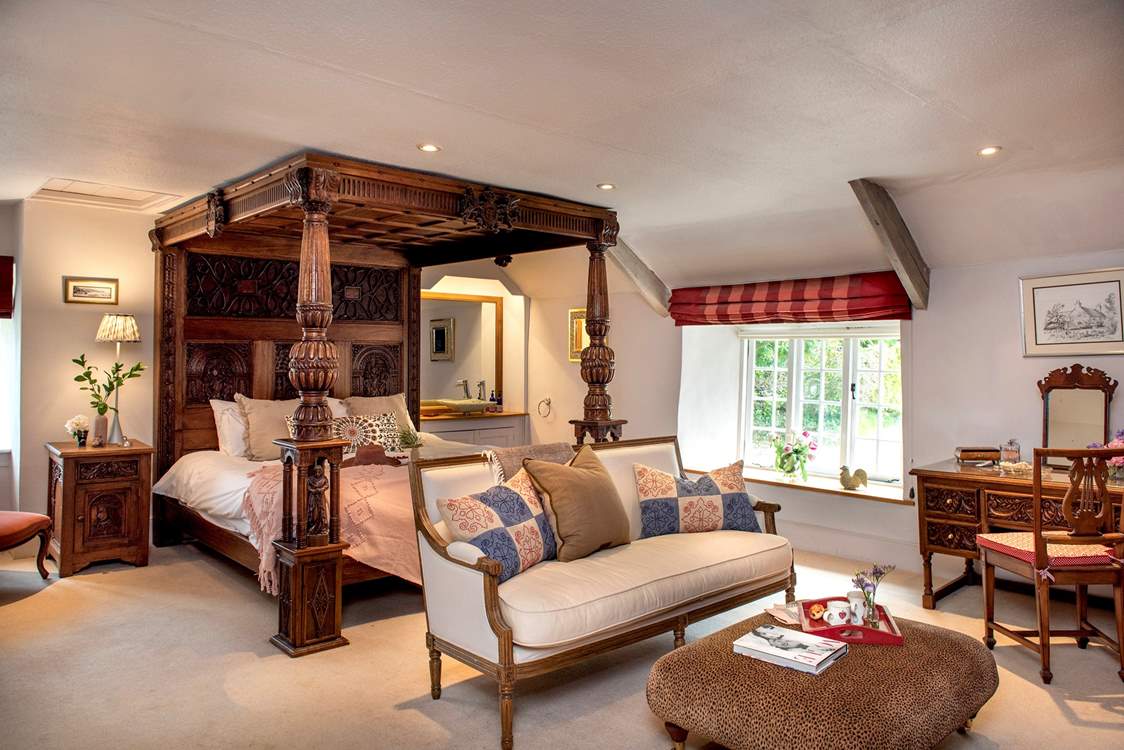 Bedroom 1 has a beautiful carved super-king four-poster bed.