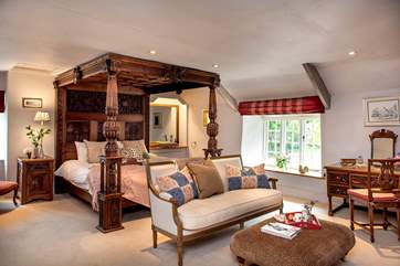 Bedroom 1 has a beautiful carved super-king four-poster bed.