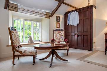 The charming sitting area in bedroom 2.