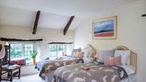 Bedroom 4 is a pretty twin bedded room and ideal for either adults or children. Access to bedroom 5 is through this room. Please mind your head when stepping down into bedroom 4 from the hallway.