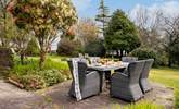 Enjoy al fresco dining overlooking the gorgeous gardens. - Thumbnail Image