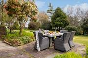 Enjoy al fresco dining overlooking the gorgeous gardens.