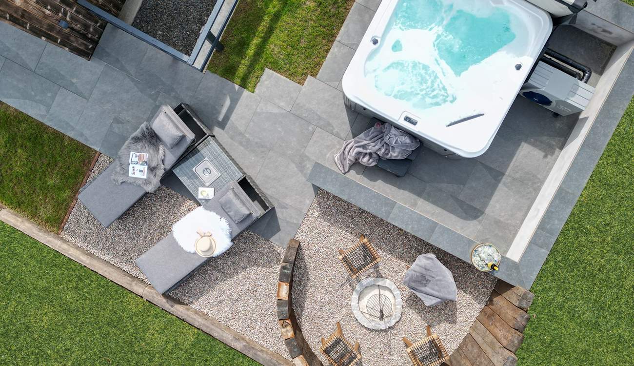 The outside space has been created with relaxation in mind, with the heavenly hot tub and dreamy fire pit area. 