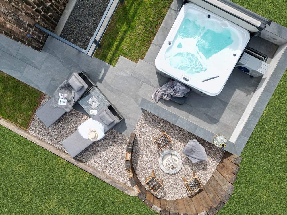 The outside space has been created with relaxation in mind, with the heavenly hot tub and dreamy fire pit area.