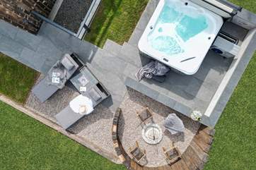 The outside space has been created with relaxation in mind, with the heavenly hot tub and dreamy fire pit area.