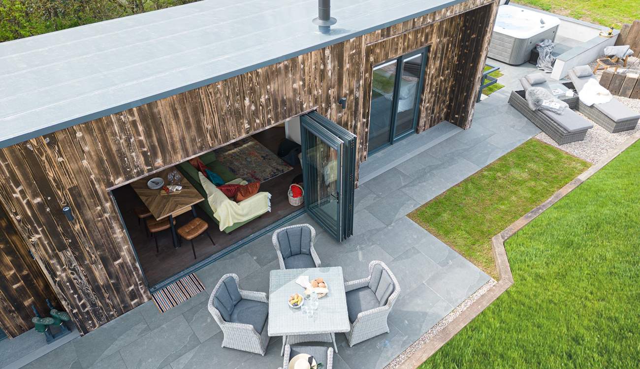 Open up the bi-fold doors and let the fresh air flow through.