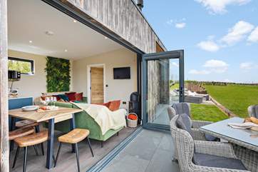 Opening up the bi-fold doors will double the size of your living space.