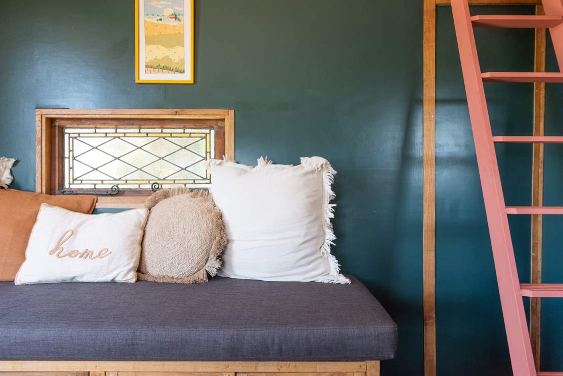 The stained glass windows add to the charming character of this hideaway.