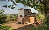 The outdoor shower is situated behind the hideaway. - Thumbnail Image