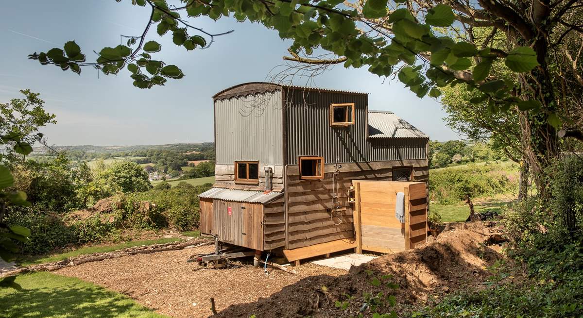 The outdoor shower is situated behind the hideaway.