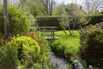 The pretty wooden footbridge to the enclosed garden, the perfect spot for a game of pooh sticks.