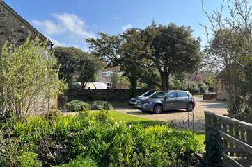 View to the courtyard parking area at the front of the cottage with plenty of space for two cars.