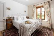 Bedroom two, with an en suite shower-room, enjoys a lovely outreach to the front of the house.