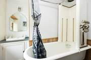 The main family bathroom with Victorian shower and bath - a real talking point!