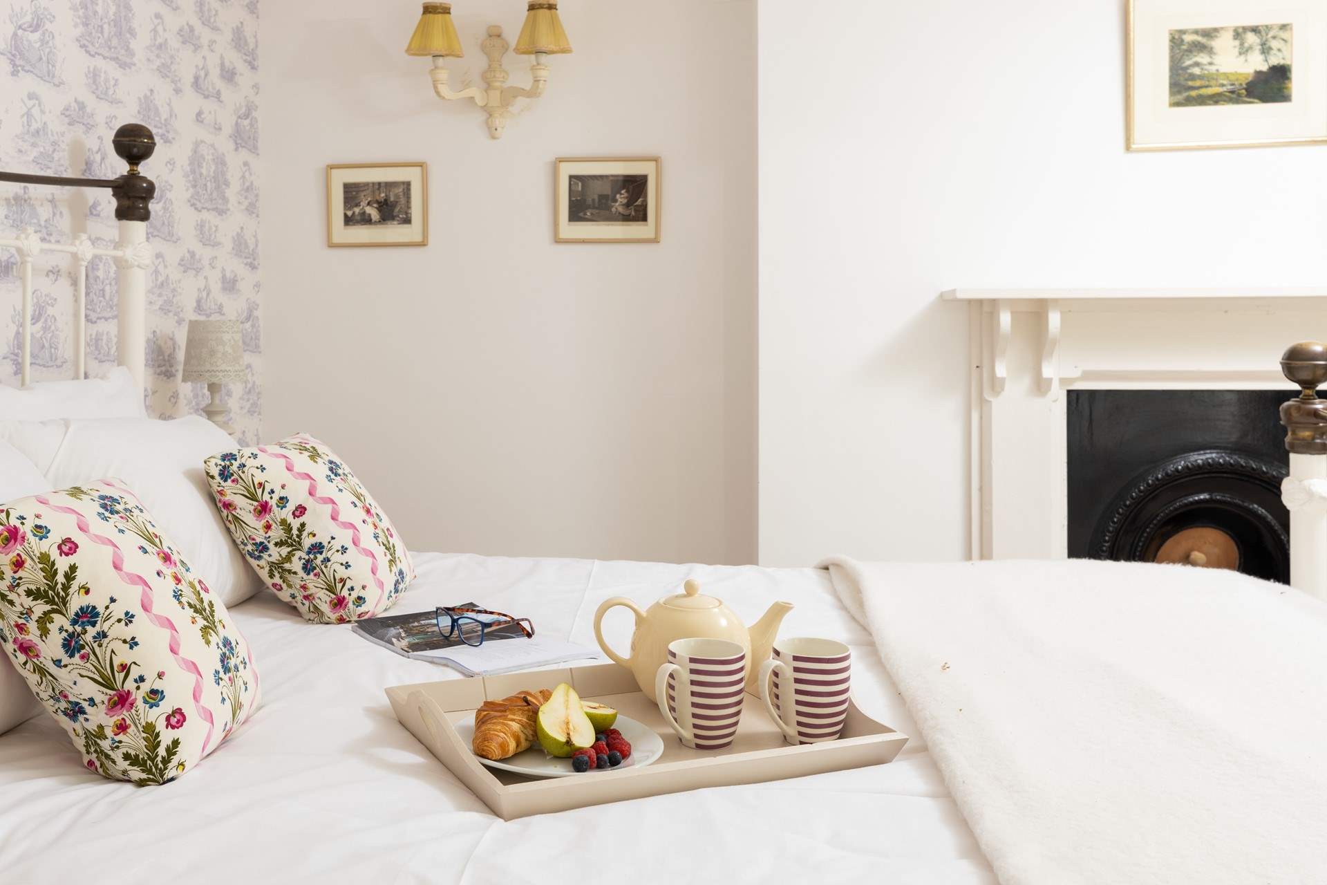 A room with a vintage French feel and lovely king-size bed.