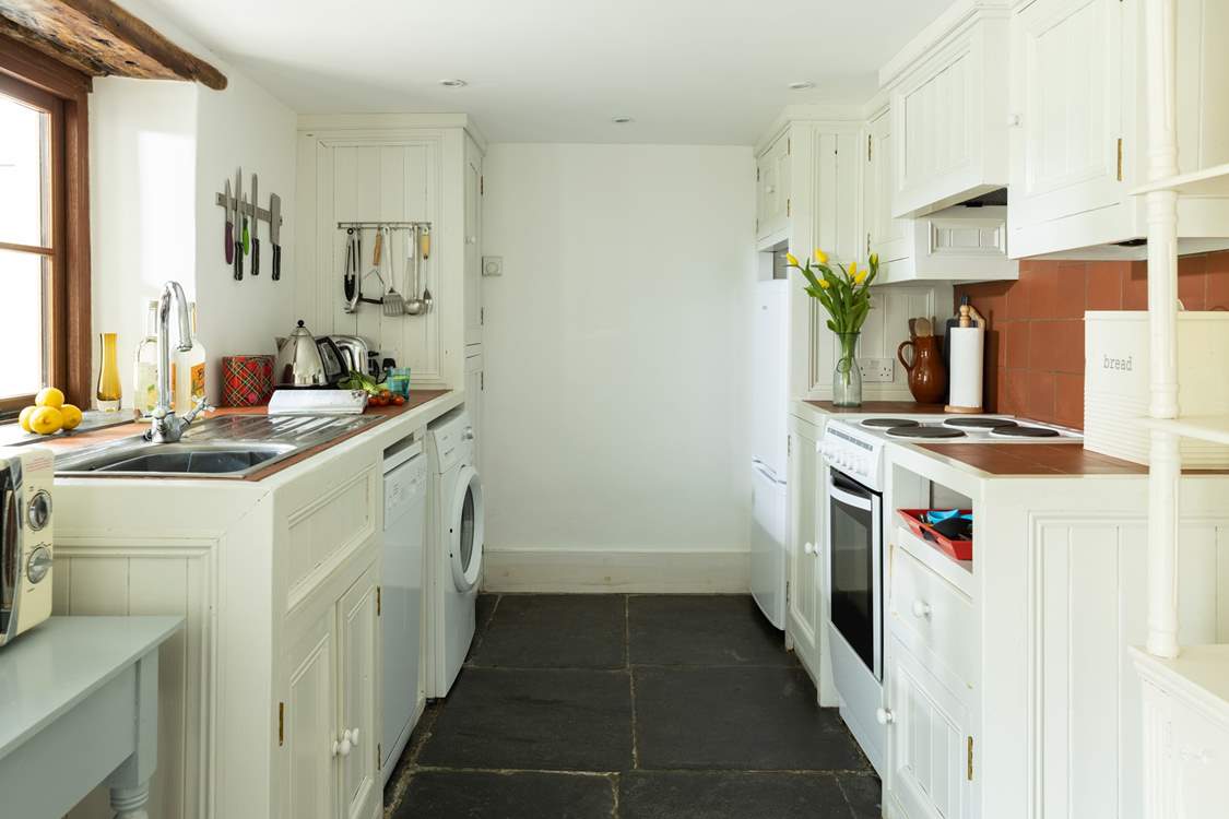 Walk through the kitchen and on to the conservatory.