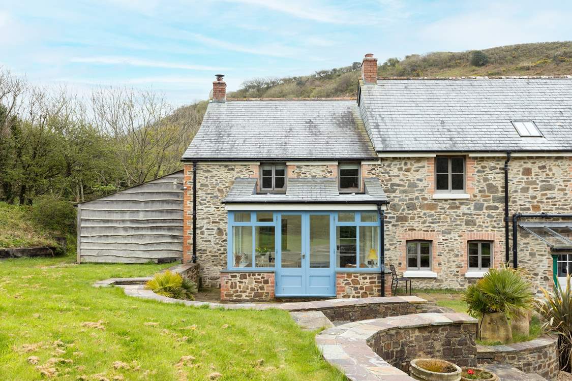 The house is semi-detached and the conservatory area overlooks the garden used by Strawberry Water House when booked.