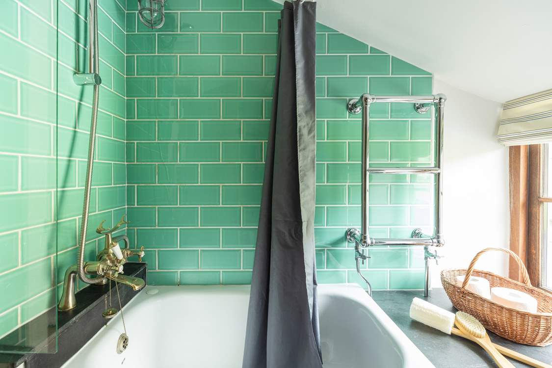 The bathroom with fitted shower - please note that the bath is not full size.