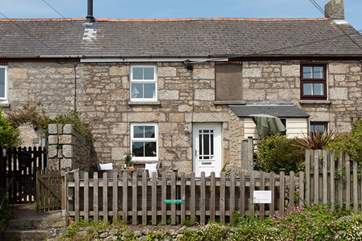 The parking space is located in front of the cottage. Steps take you up to the path way.
