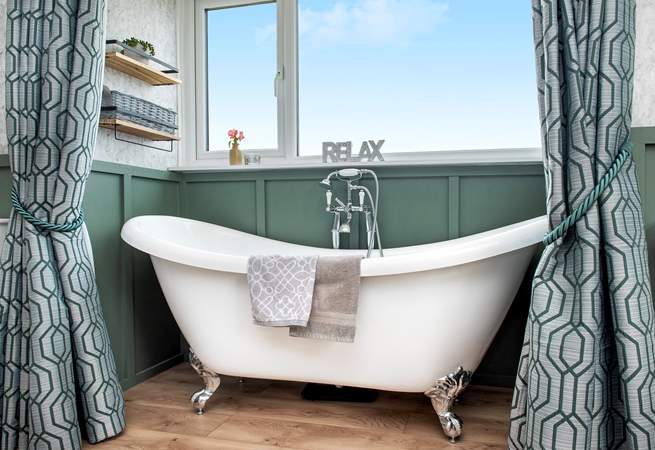 Relax and unwind in the gorgeous bathtub.