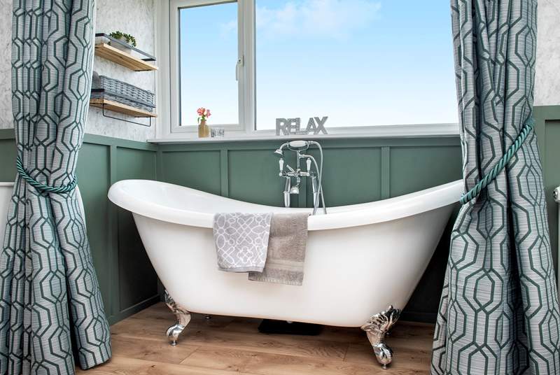 Relax and unwind in the gorgeous bathtub.