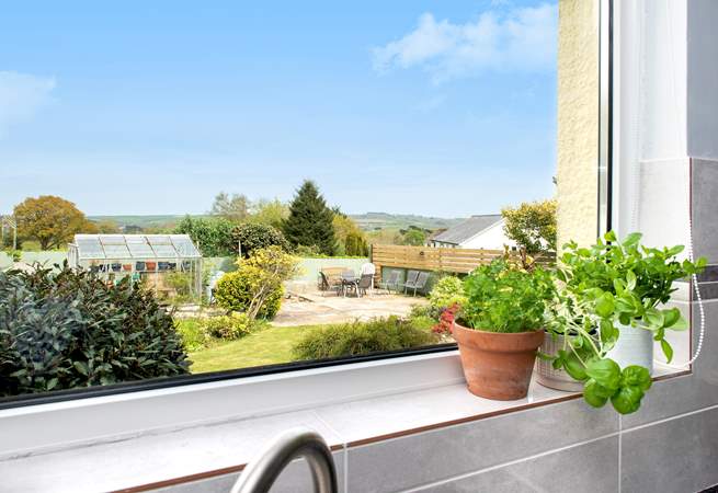 From the kitchen you can enjoy the view over the back gardens that certainly makes the most of the views.