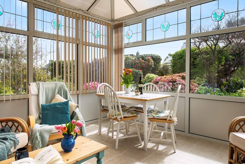 From the sunny conservatory you can look out over the front garden.....