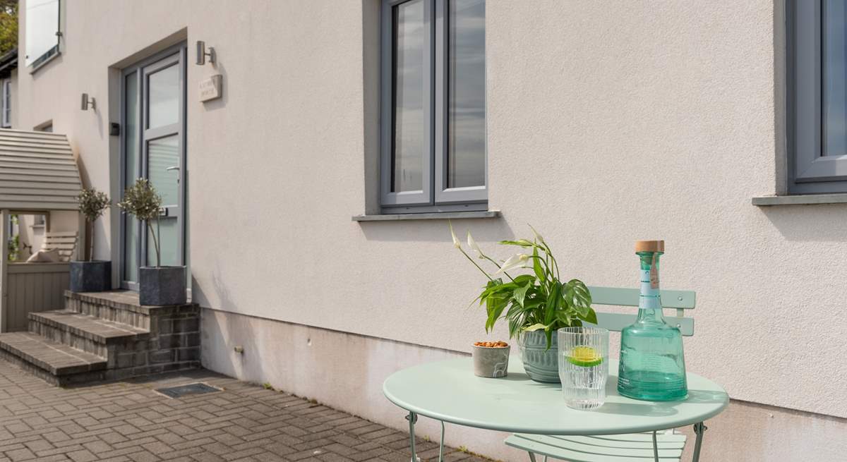 The bistro table invites you to pull up a pew and watch the comings and goings along the river.