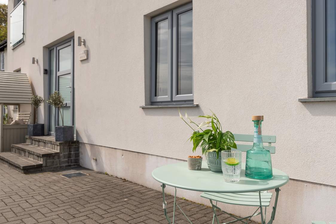 The bistro table invites you to pull up a pew and watch the comings and goings along the river.