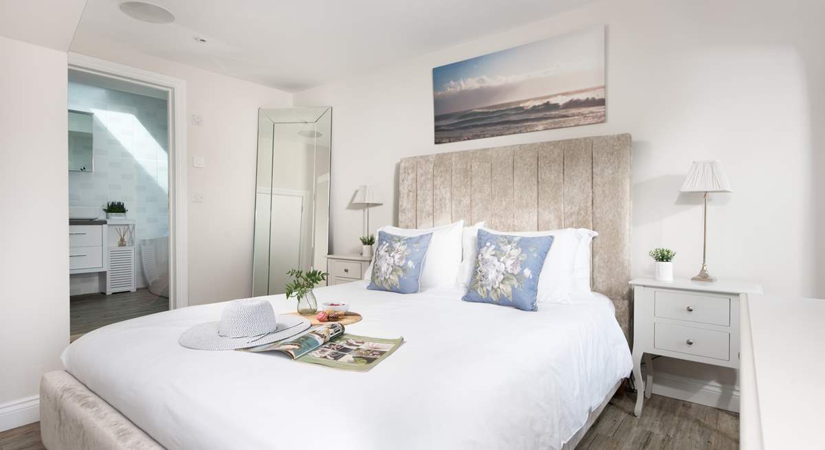 The main en suite bedroom has gorgeous river views and a king-size bed.