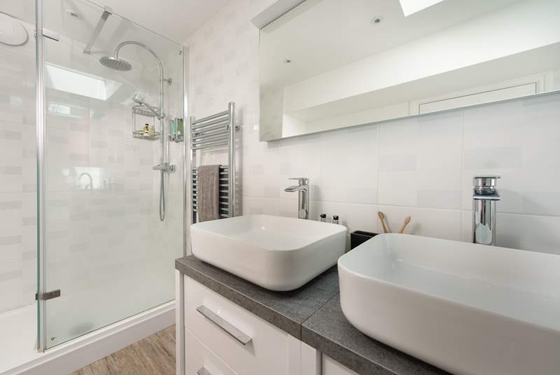 Twin sinks for that added bit of luxury and a separate enclosed shower.